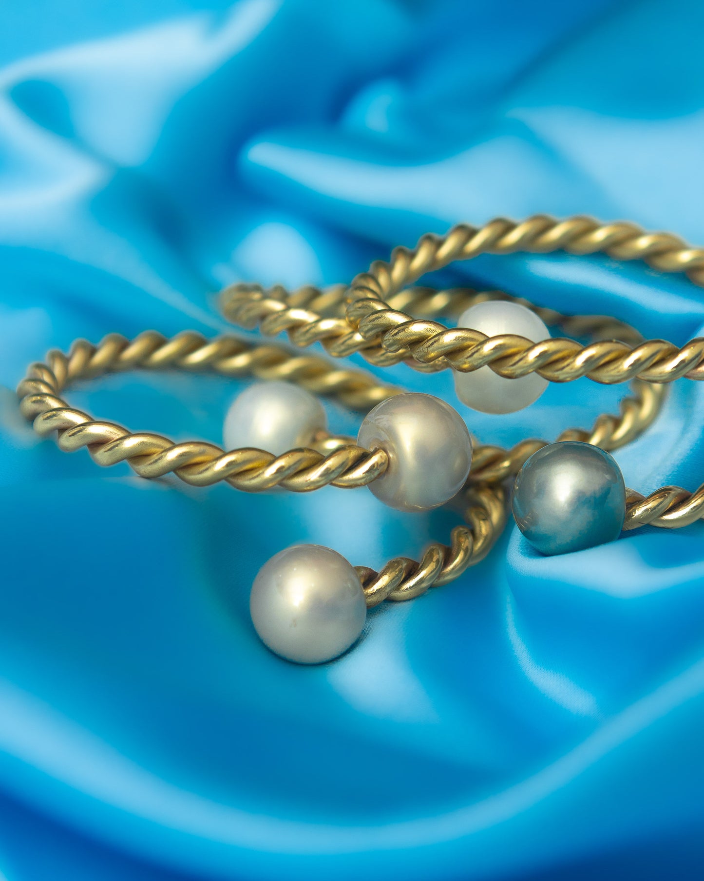 Handmade brass pearl bangles by Adjeley Jewellery