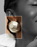 Yaayaa stud earrings made from hand-faceted wood and silver foil, handmade in Ghana