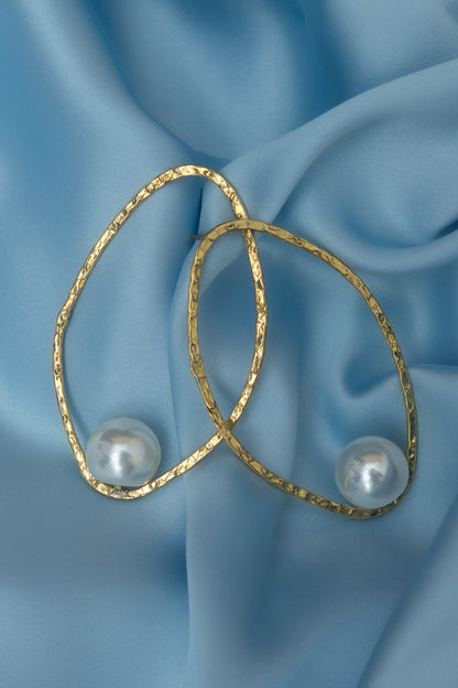 Lamiorkor stud earrings made from textured brass with white pearl detail