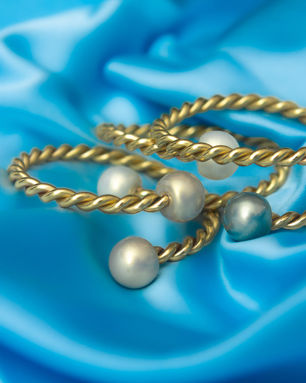 Handmade brass pearl bangles by Adjeley Jewellery