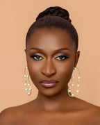 Sculptural pearl earrings inspired by Ghanaian culture