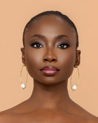Luxury handmade brass pearl earrings crafted in Ghana