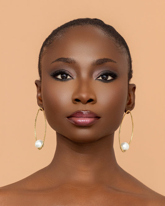 Luxury handmade brass pearl earrings crafted in Ghana