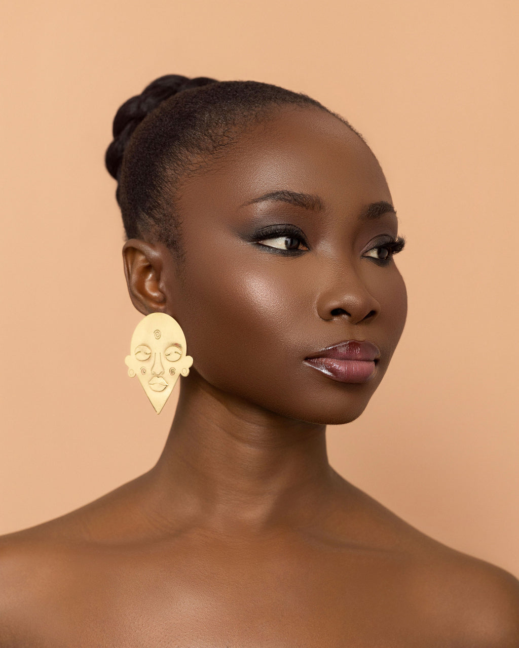 Esaaba stud earrings handcrafted from brass inspired by African masks