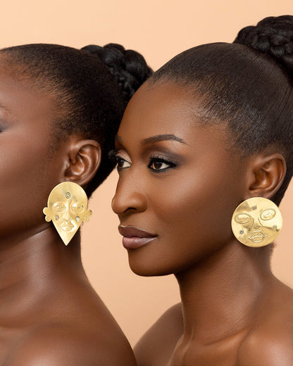 Sculptural African-inspired brass earrings crafted in Ghana