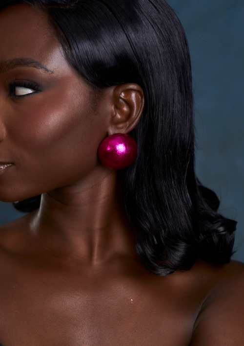 Alma magenta statement stud earrings made from wood and metallic foil, handmade in Ghana