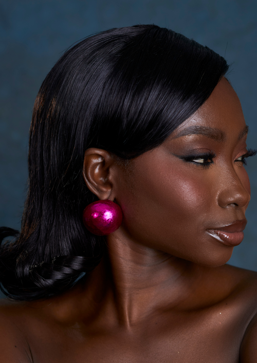 Alma magenta statement stud earrings made from wood and metallic foil, handmade in Ghana