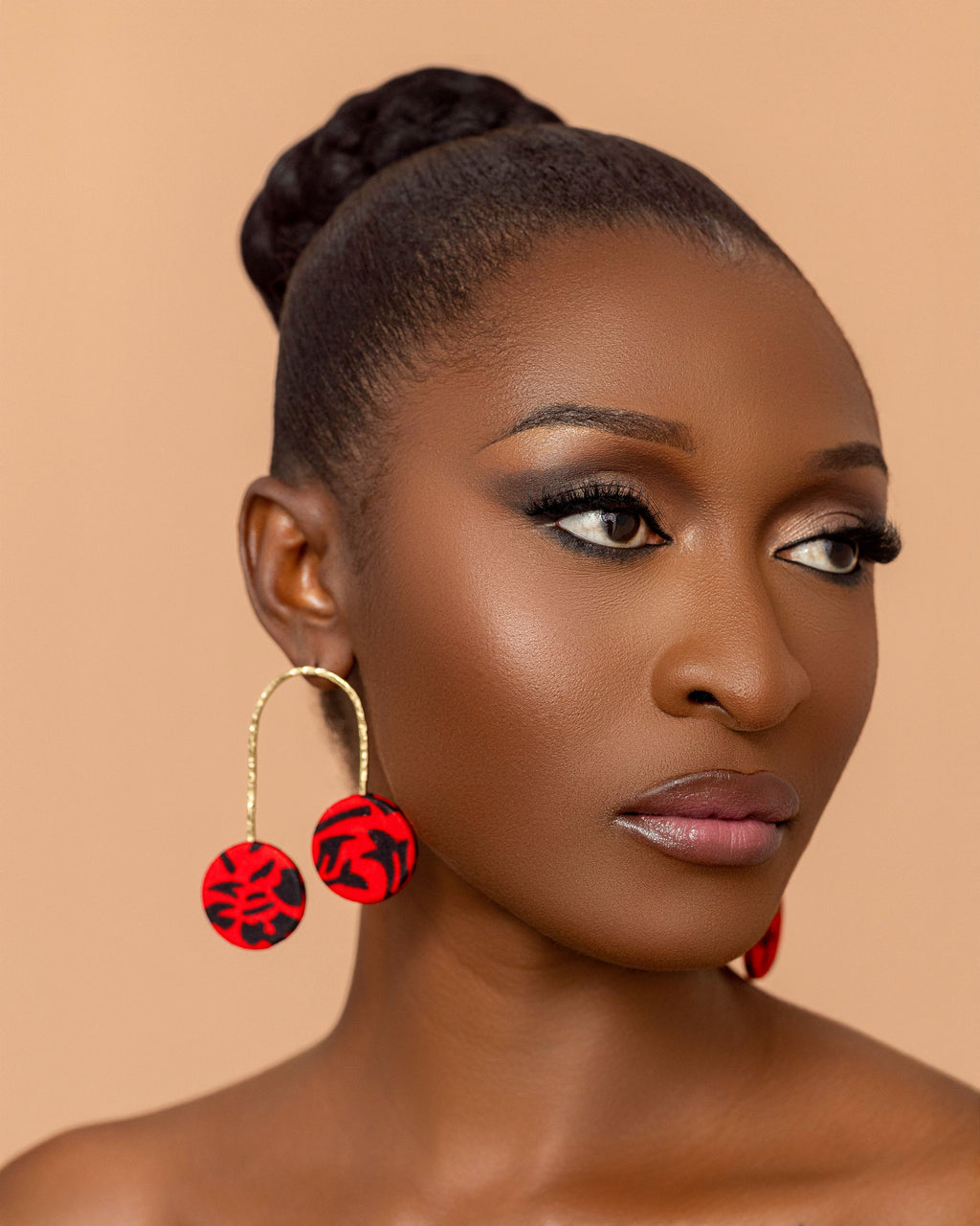 Takyiwaa red earrings handmade from textured brass and African print fabric