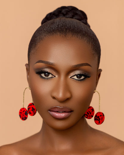 Takyiwaa red earrings handmade from textured brass and African print fabric