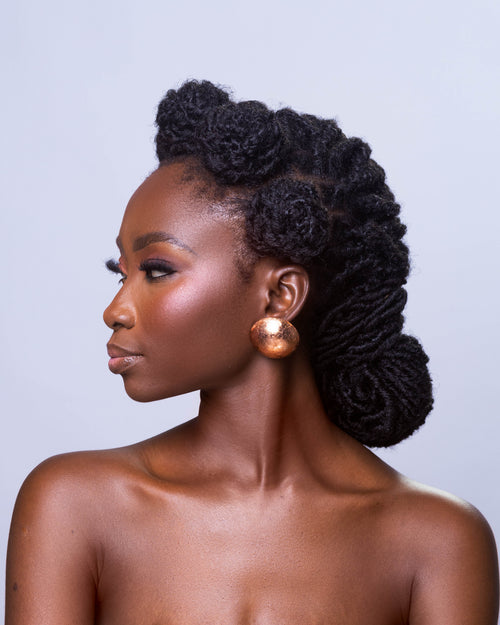 Alma gold statement stud earrings made from wood and metallic foil, handmade in Ghana